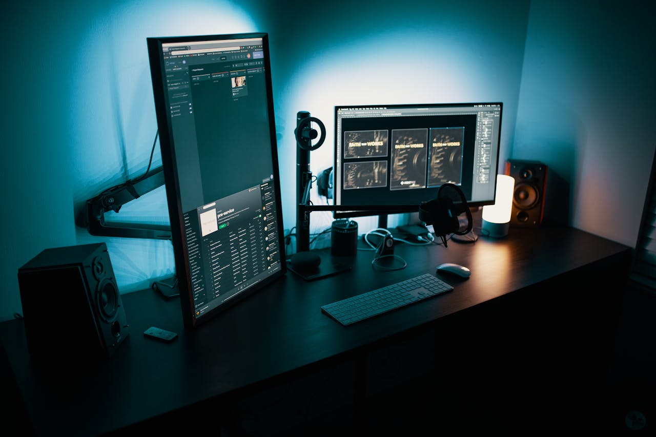 Services-03 A contemporary office desk featuring a dual monitor setup with stylish lighting, ideal for tech enthusiasts.